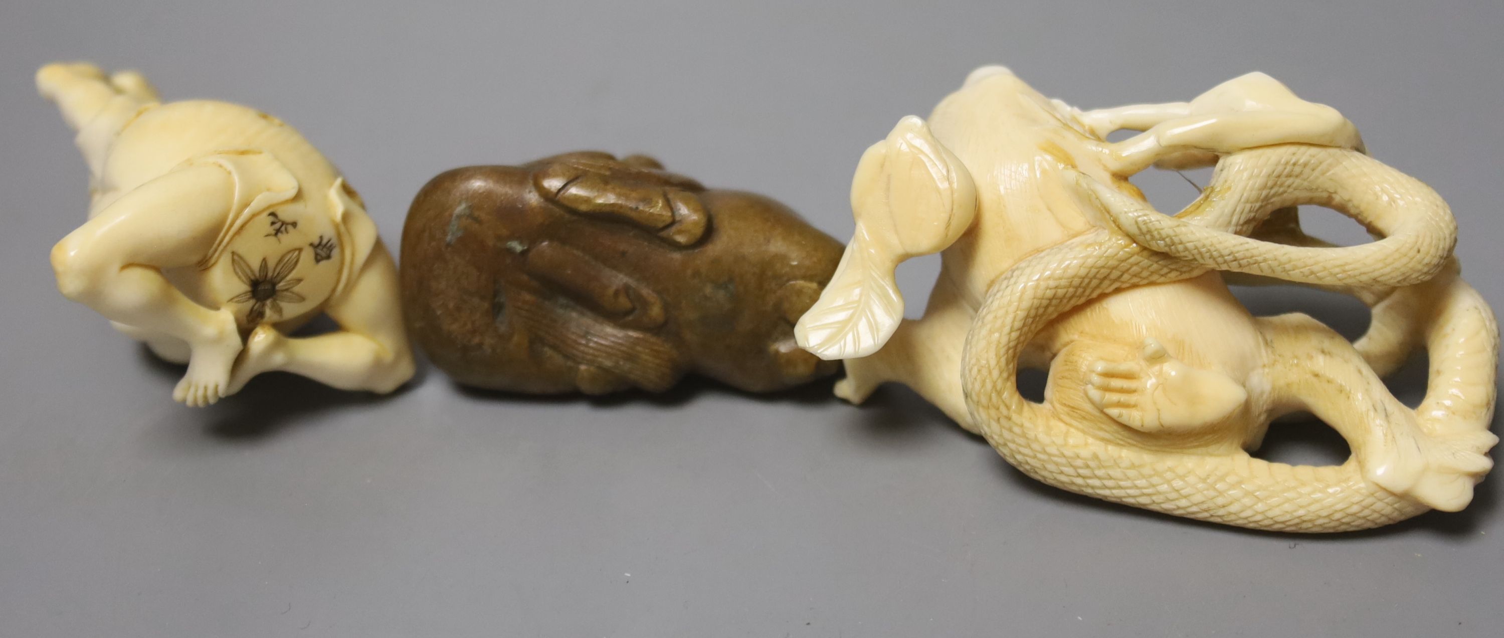 Two ivory carvings and a bronze